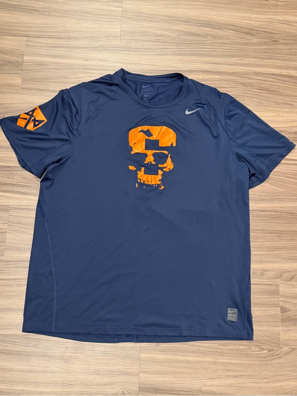 Nike Men’s Navy Short Sleeve Dri-FIT Tee with Orange Skull Graphic